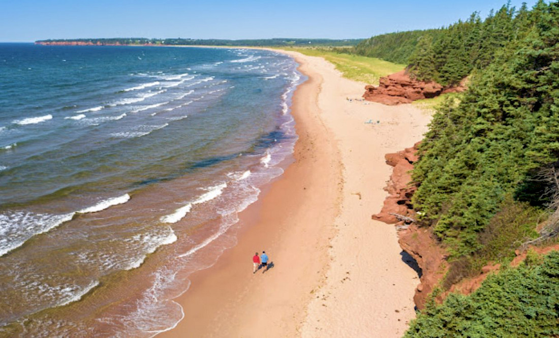 Stroll along unspoiled peach-colored beaches.