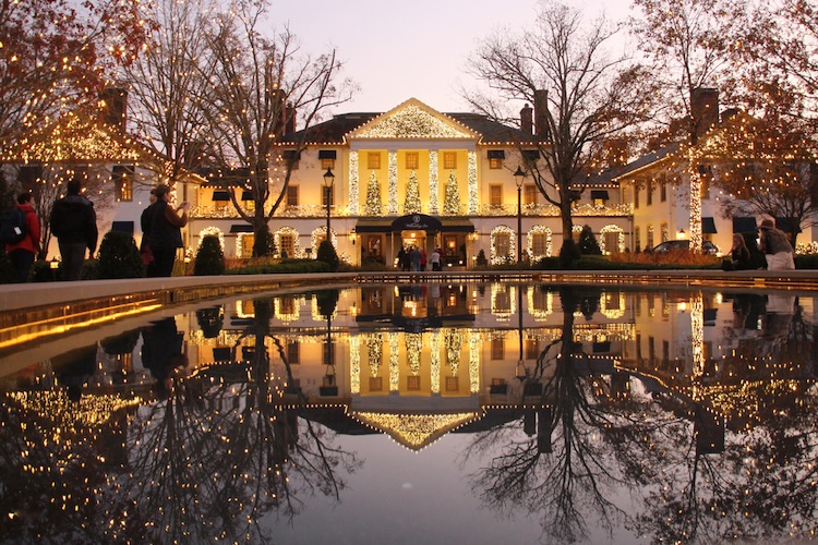 Williamsburg Inn Decorated for the Holidays is Shown Reflected in an Outdoor Fountain.