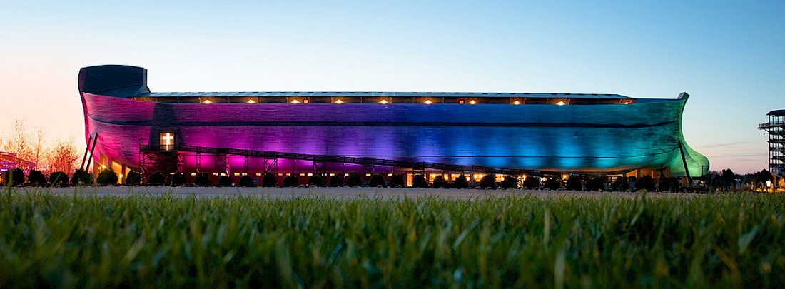 The Ark Encounter lite-up with the colors of the rainbow.