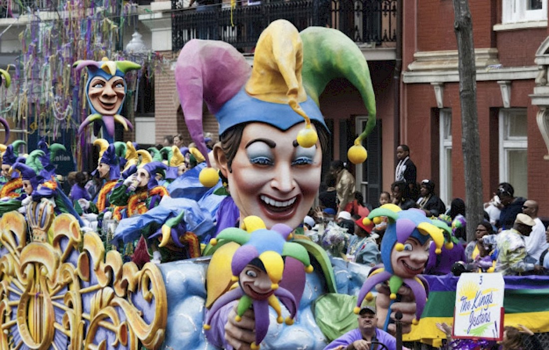 Beads, music and colorful floats line the streets of the French Quarter in New Orleans.
