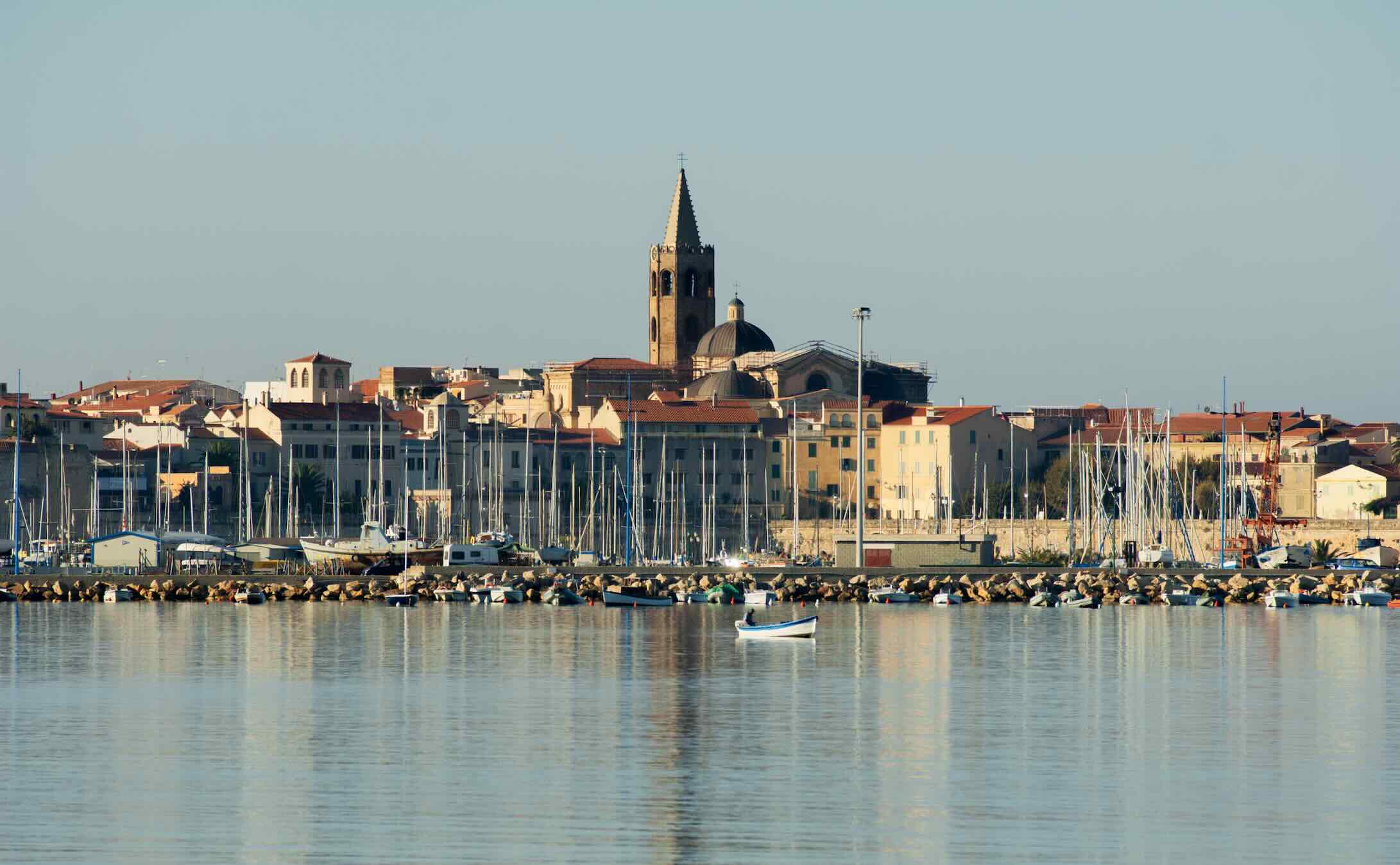 Alghero is a captivating medieval port town known for its remarkably well-preserved old city, turquoise waters, and a unique cultural identity unlike anywhere else on Sardinia.
