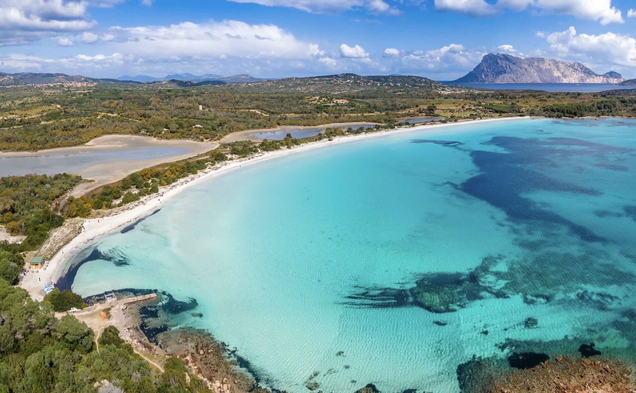 Seniors enjoy the powdery white sandy beaches of the Mediterranean on a small group tour.